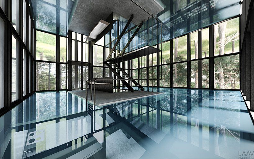 Swimming pool placed in a glass frame in a residence in the forest