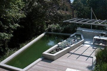 Biological swimming pool in an ecological oasis